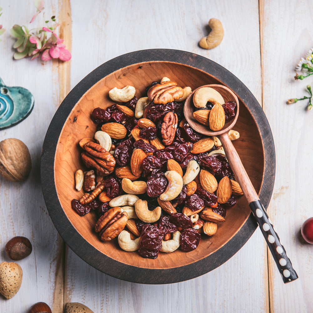 A bowl of mixed nuts and dried cherries