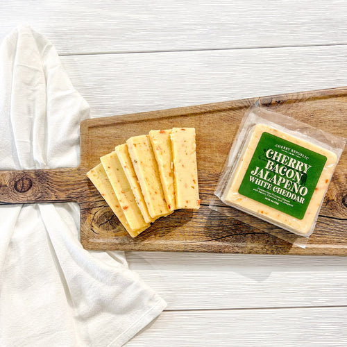 A pack and a couple of slices of Cherry Republic cherry jalapeno cheese