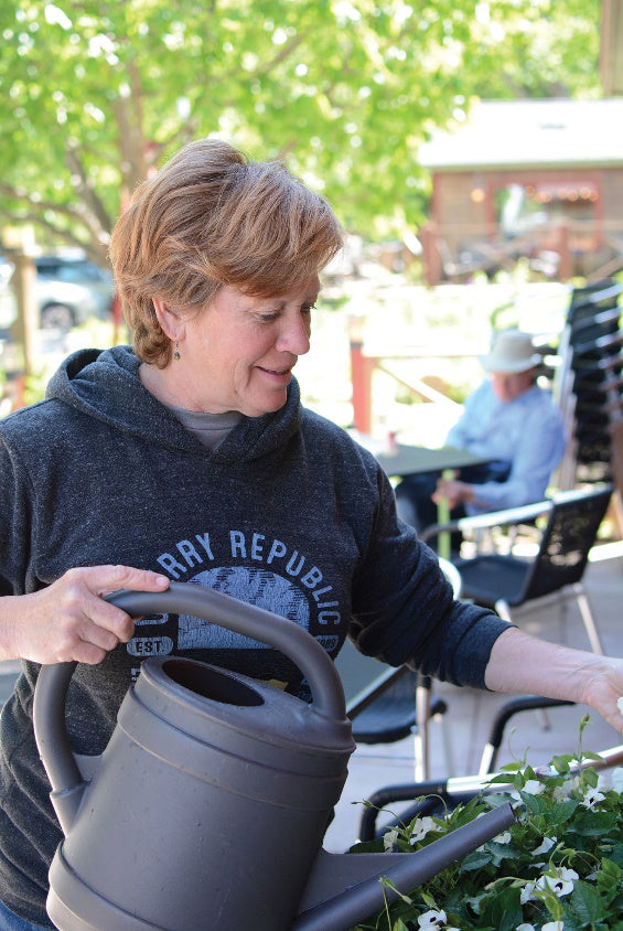 A woman watering her plants