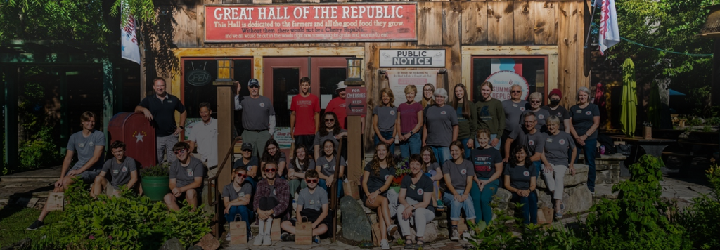 A group of people in front of a Cherry Republic store